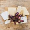 red-grapes-cheese-blocks-wooden-board